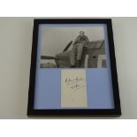 A framed and glazed display of black and white photographic still of DOUGLAS BADER the highly