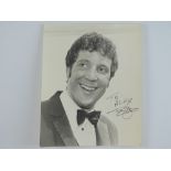 An early signed and dedicated black/white 10x8 photograph of TOM JONES - PROVENANCE: The Alex