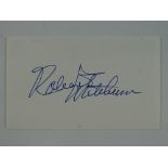A ROBERT MITCHUM signed 5 x 3 card - this has been independently checked and will be supplied with a