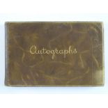 A vintage autograph book containing a NOEL COWARD autograph in addition to many other unknown