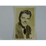 A vintage black/white photograph circa 1947, signed RONALD REAGAN with handwritten note to rear -