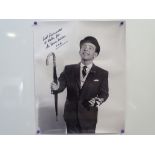 NORMAN WISDOM - Signed and dedicated black and white 16x20 photograph together with a 10x8 for