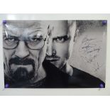 BREAKING BAD: A pair of signed photographs comprising: A 16x12 signed by BRYAN CRANSTON and AARON