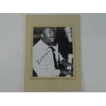 A signed 10x8 black/white photograph of FATS DOMINO - this has been independently checked and will