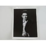 An early signed black/white 10x8 photograph of JOHNNY CASH - some creasing - PROVENANCE: The Alex