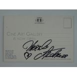 A URSULA ANDRESS signed postcard - this has been independently checked and will be supplied with a