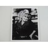 A signed black/white 10x8 photograph of DOLLY PARTON - PROVENANCE: The Alex Brown Autograph