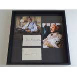 JAMES BOND: A framed and glazed display of 007 photographs with two signature cards: SEAN CONNERY