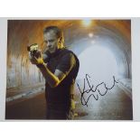 24: KIEFER SUTHERLAND - A signed colour 10x8 action photograph - this has been independently checked