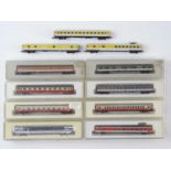A mixed group of MARKLIN Z Gauge German and Swiss Outline passenger coaches in various liveries -