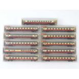 A group of N Gauge German Outline passenger coaches by FLEISCHMANN all in TEE red/cream livery -