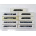 A group of MARKLIN German Outline Z Gauge passenger coaches in DB ocean blue/beige and green