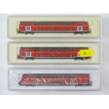 A group of MARKLIN Z Gauge German Outline passenger coaches forming a double deck push-pull train