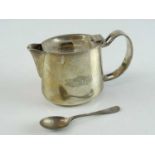 A silver plate tea/hot water pot (4" tall) and tea spoon - both with Pullman Railway Company Crests