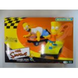 A MICRO SCALEXTRIC The Simpsons Skateboard Chase slot racing set, appears complete as new - VG/E