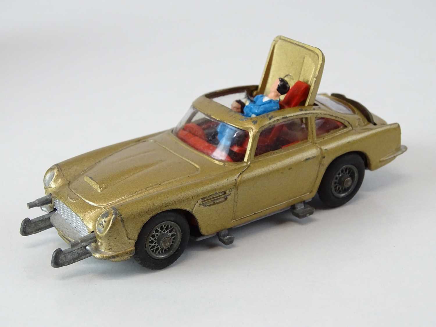 A CORGI Toys 261 James Bond's Aston Martin in gold with working bullet shield, guns and ejector seat - Image 3 of 4