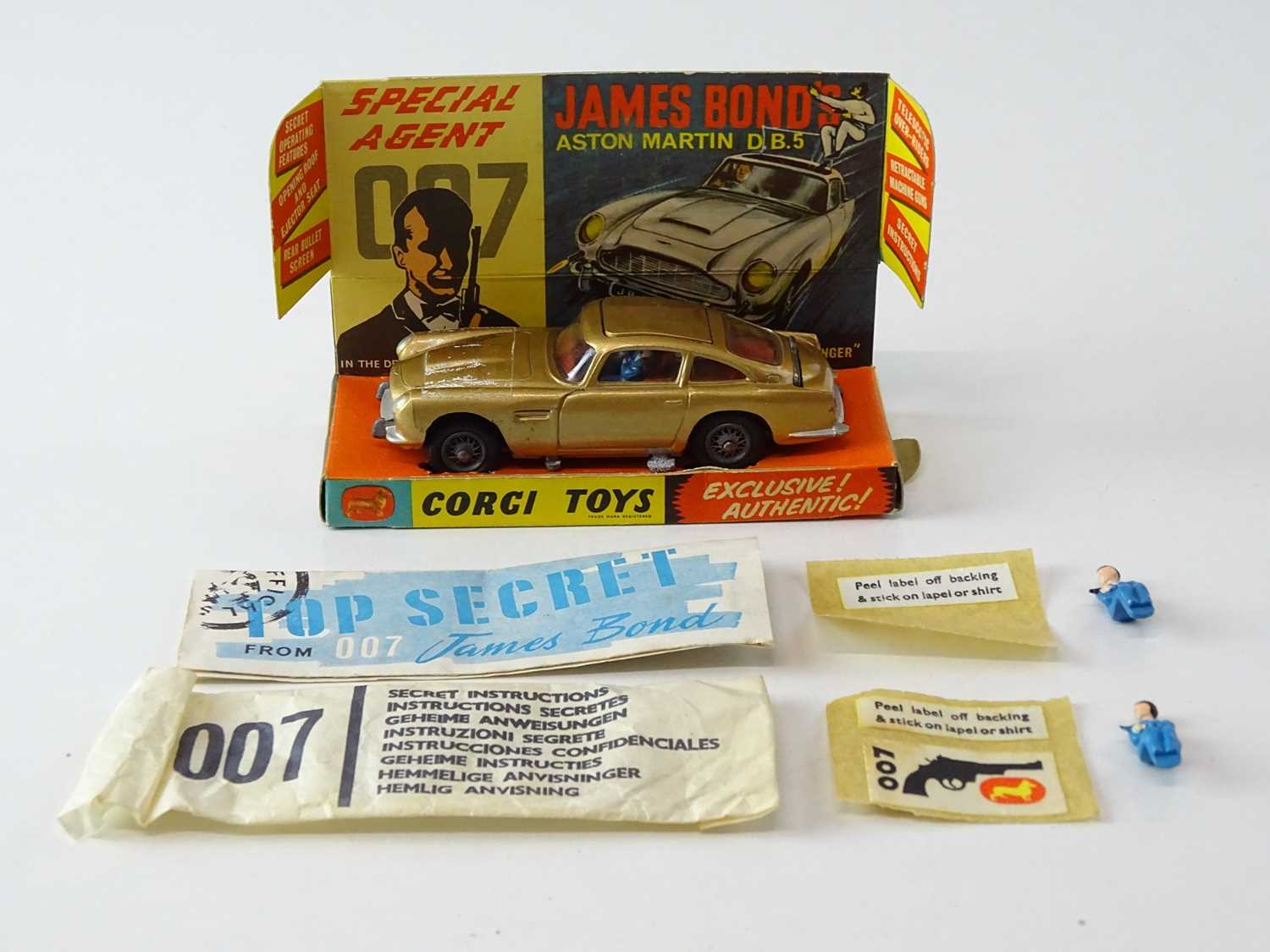 A CORGI Toys 261 James Bond's Aston Martin in gold with working bullet shield, guns and ejector seat