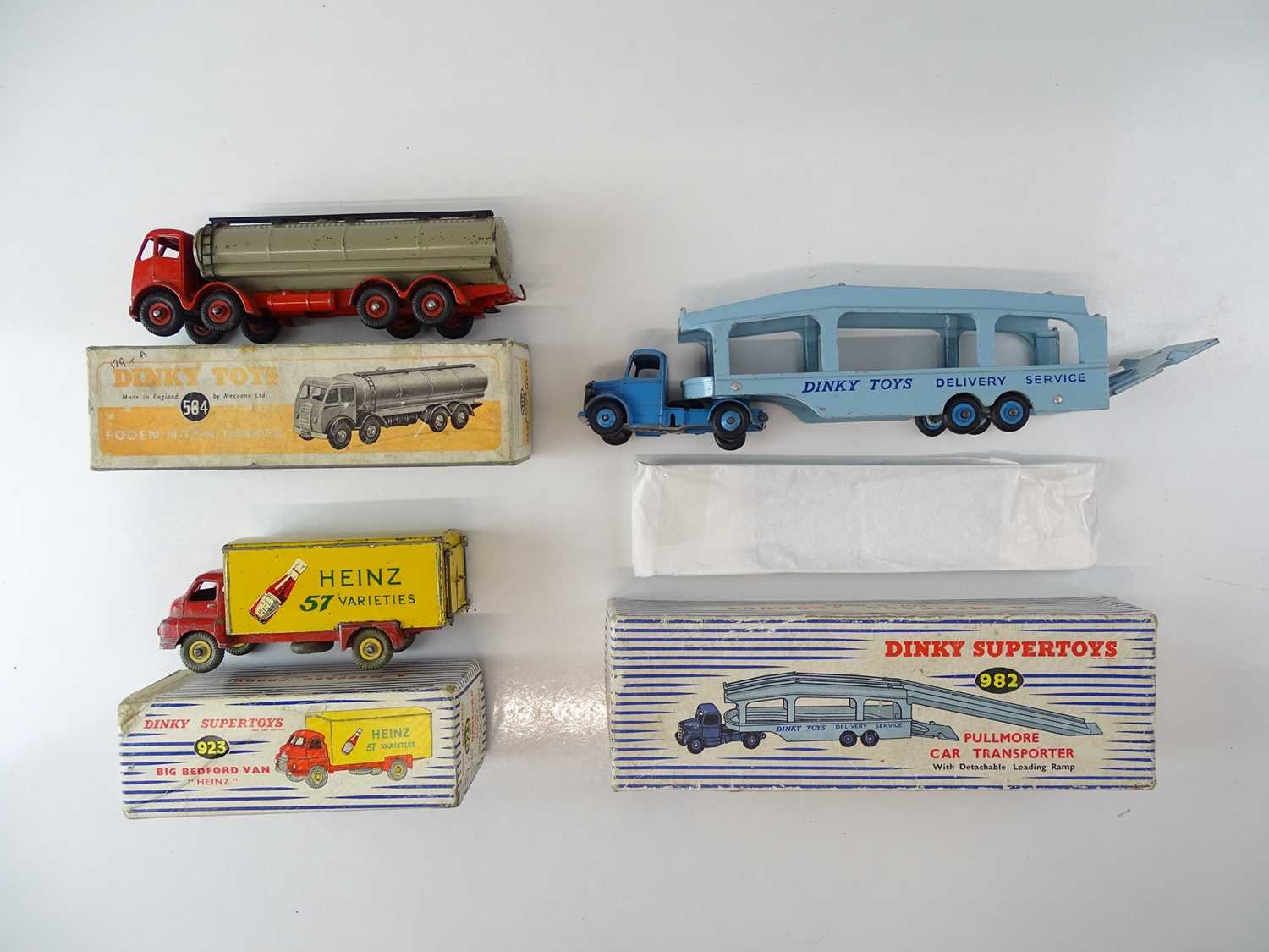 A group of playworn trucks by DINKY comprising: 584; 923 and 982 - F/G in F/G boxes (3)