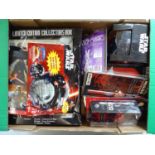 A large group of STAR WARS collectable items including a Darth Vader money bank together with books,