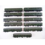 A group of TRI-ANG TT Gauge unboxed Class 104 DMUs comprising 3 power cars, 3 driving trailers and 5