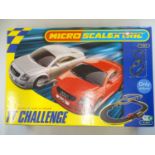 A MICRO SCALEXTRIC TT Challenge slot racing set, appears complete as new - VG/E in VG box