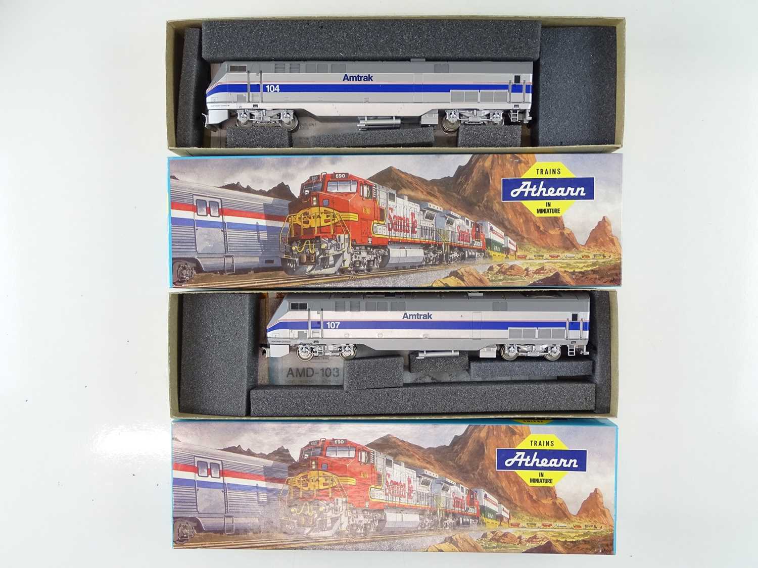 A pair of HO Gauge ATHEARN kit built American Outline 3653 and 3654 AMD-103 P40 Power Cars in Amtrak