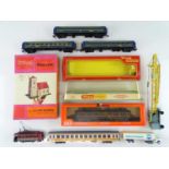 A group of HO rolling stock and HO/OO accessories and a couple of empty Tri-ang boxes to include a