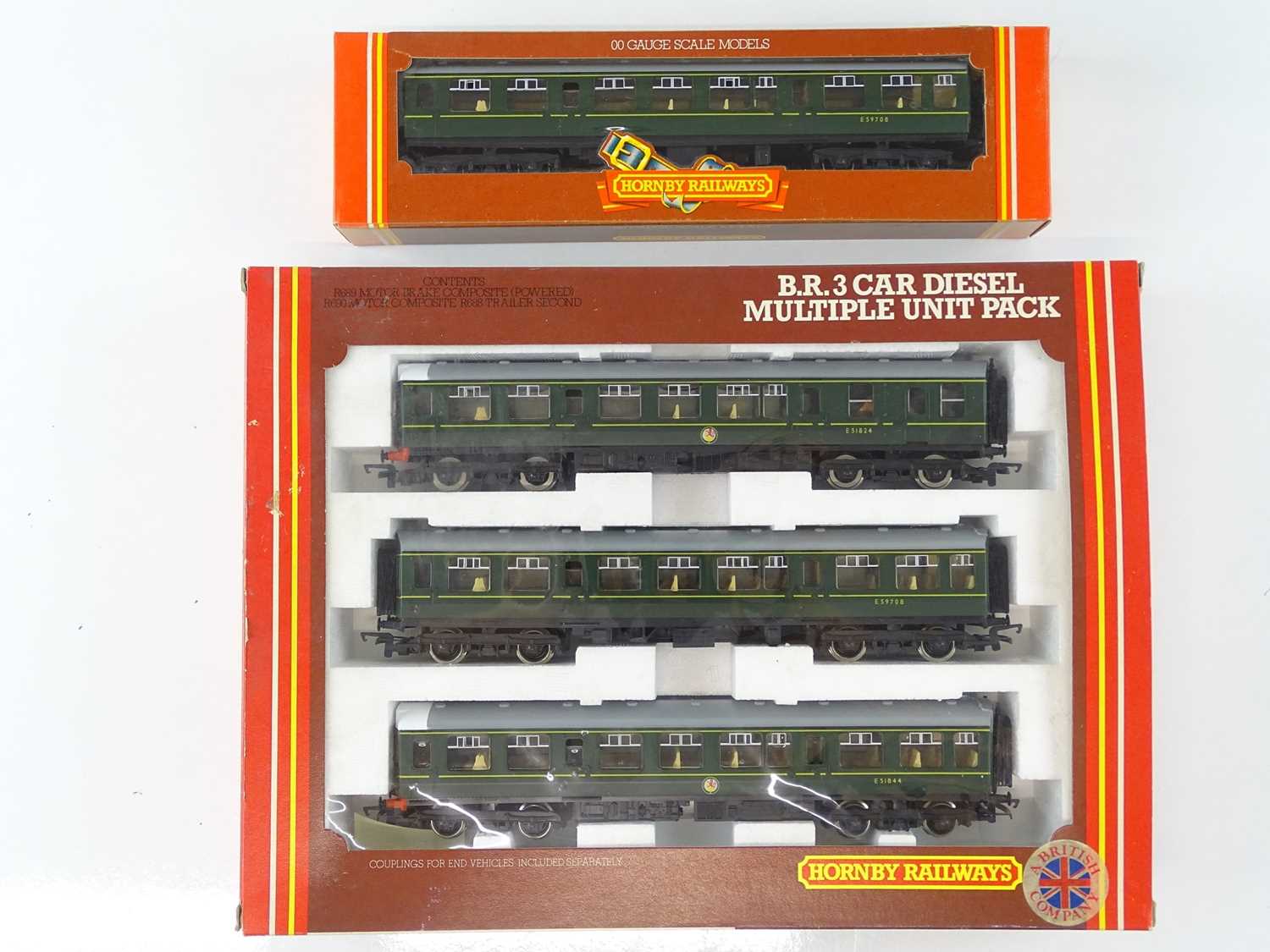 A HORNBY R687 Class 110 3-Car DMU together with an R688 additional trailer coach - all in BR green -