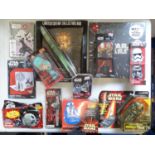 A large group of STAR WARS collectable items including an electronic communicator together with