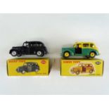 A pair of DINKY 254 Austin Taxis in black and two tone green/yellow - G in F/G boxes (2)