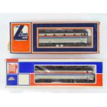 A pair of HO Gauge American Outline electric locomotives repainted in Amtrak livery by LIMA and