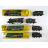 A group of unboxed TRI-ANG TT Gauge steam locomotives comprising 2 x Castle Class and 2 x Merchant