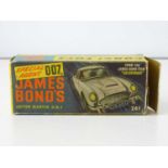 A CORGI Toys 261 James Bond's Aston Martin in gold with working bullet shield, guns and ejector seat