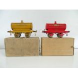 A pair of early HORNBY SERIES O Gauge petrol tank wagons comprising National Benzole and Shell -