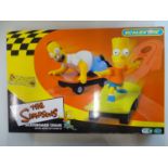 A MICRO SCALEXTRIC The Simpsons Skateboard Chase slot racing set, appears complete as new - VG/E