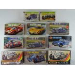 A group of unbuilt 1:32 scale plastic car kits by AIRFIX and MATCHBOX (contents unchecked but appear