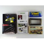 A group of slot racing cars comprising a pair of 1:32 examples by SCALEXTRIC together with a 1:18