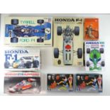 A group of unbuilt 1:12/20/24 scale plastic/metal car kits, primarily Formula 1 examples by