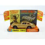 A CORGI 261 James Bond's Aston Martin in gold with working bullet shield, guns and ejector seat -