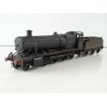 A kit built finescale O Gauge class 28xx 2-8-0 steam locomotive in BR heavily weathered black livery