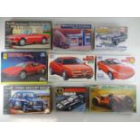 A group of unbuilt 1:24 scale plastic car kits, including Alfa Romeo examples by TAMIYA, REVELL