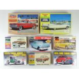 A group of unbuilt 1:32 scale plastic car kits, primarily American examples by REVELL, LINDBERG