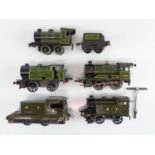 A group of HORNBY O Gauge clockwork locos for spares or repair (a couple with extensive