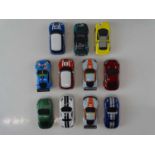 A large quantity of MICRO SCALEXTRIC to include eleven cars and track - G (unboxed) (Q)