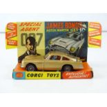 A CORGI 261 James Bond's Aston Martin in gold with working bullet shield, guns and ejector seat -