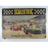 A vintage SCALEXTRIC Set 31 slot racing set, contents appear complete - G in F box