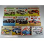 A group of unbuilt 1:24 scale plastic car kits, primarily racing examples by AIRFIX (contents