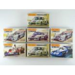 A group of unbuilt 1:32 scale plastic car kits, primarily racing examples by MATCHBOX (contents