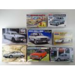 A group of unbuilt 1:24 scale plastic car kits, various examples by MONOGRAM, TAMIYA and others (