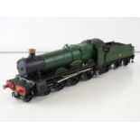 A kit built finescale O Gauge Saint Class 4-6-0 steam locomotive in GWR green livery named "Saint